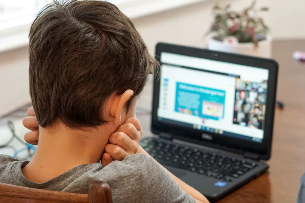 Child engaged in online learning