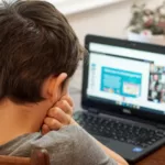 Child engaged in online learning