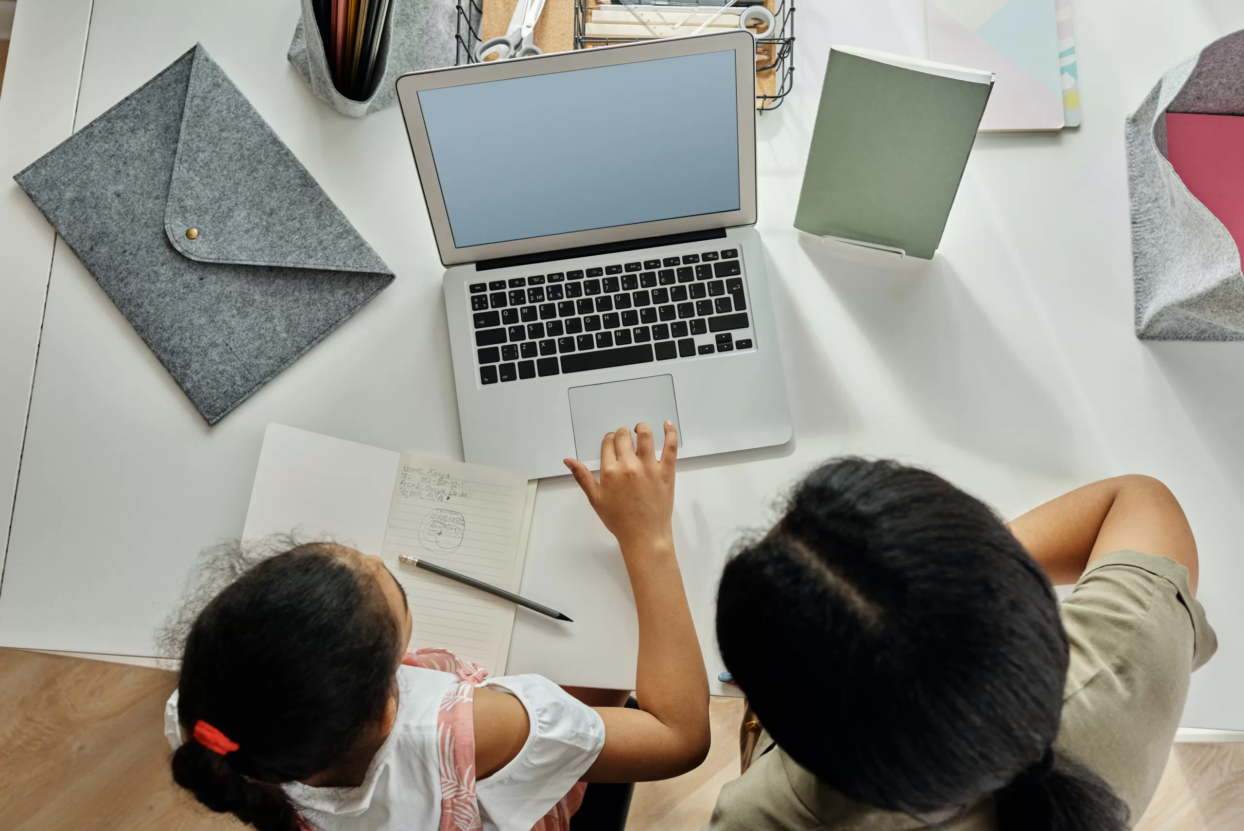 parent with child overcoming coding hurdles together.